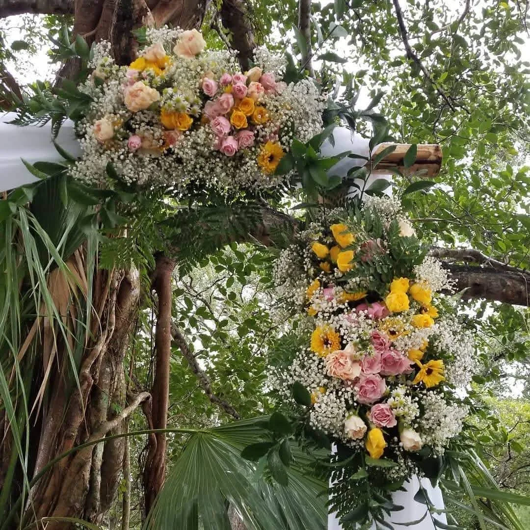 wedding reception with enclosed tent, floral backdrop and full table setup in Miami — 2