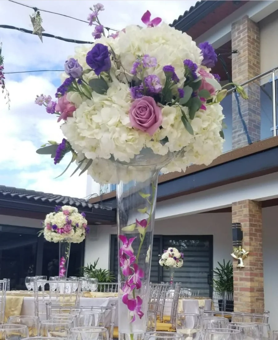 wedding reception with enclosed tent, floral backdrop and full table setup in Miami — 5