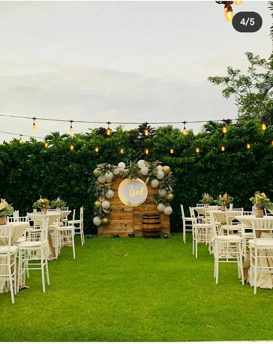 wedding reception with enclosed tent, floral backdrop and full table setup in Miami — 6