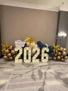 Graduation party setup with caps, banner and catering in Miami