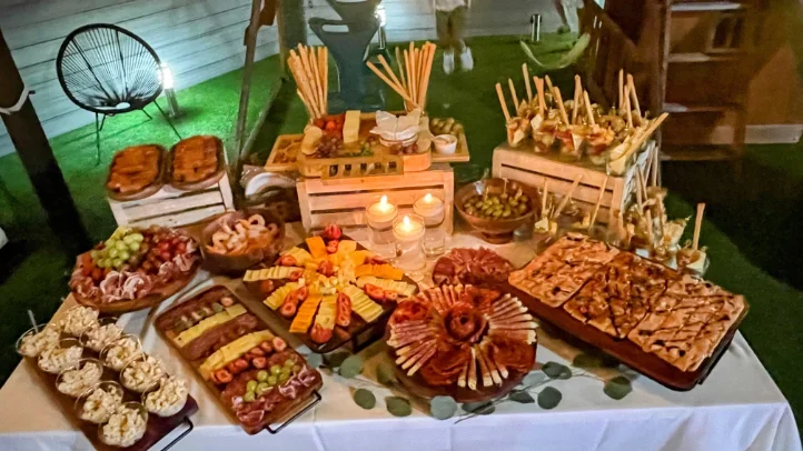 Catering buffet with Latin dishes and chafing trays at a Miami event