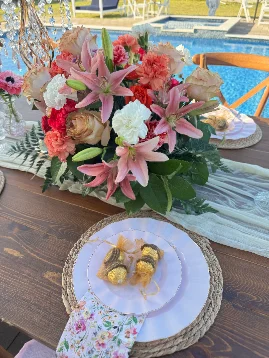 Balloon arch and floral backdrop décor at a South Florida party
