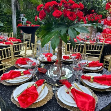 Round tables with linens, chairs and place settings ready for a Miami event